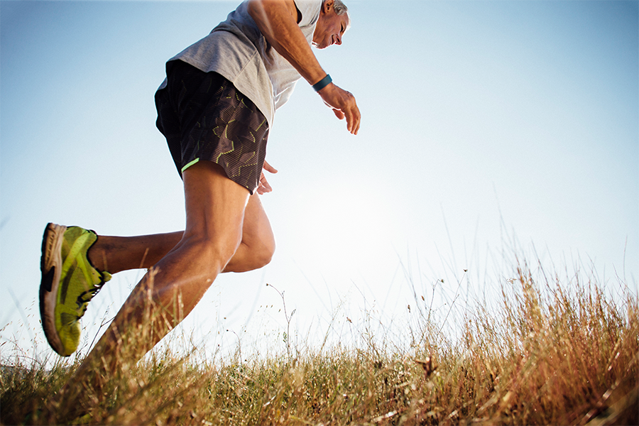 Man running in a grassy field